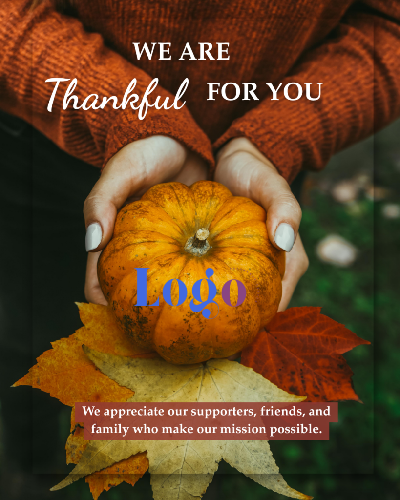 A pumpkin, being held with leaves against a dark green background, we are thankful for you.